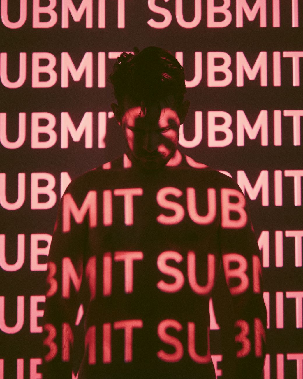 word submit projected onto figure of man