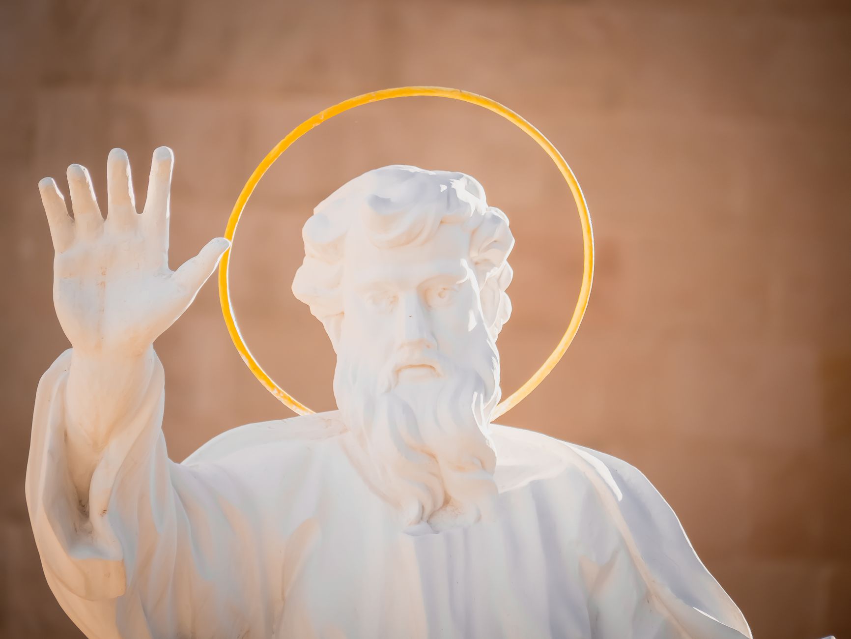 serene white marble religious sculpture with halo